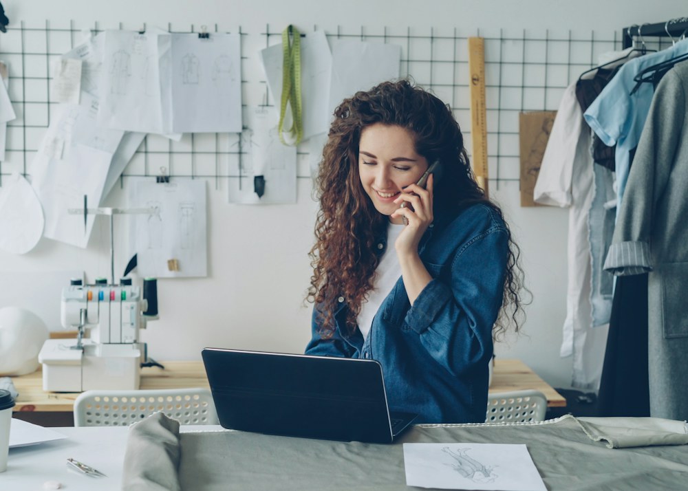 A small business owner at her desk with a laptop